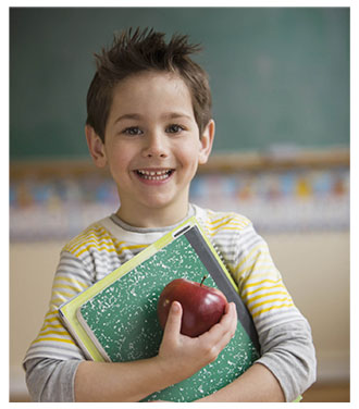 Child in school with apple